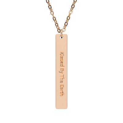 Rose Gold necklace with a bar pendant engraved 'Kissed By The Earth'
