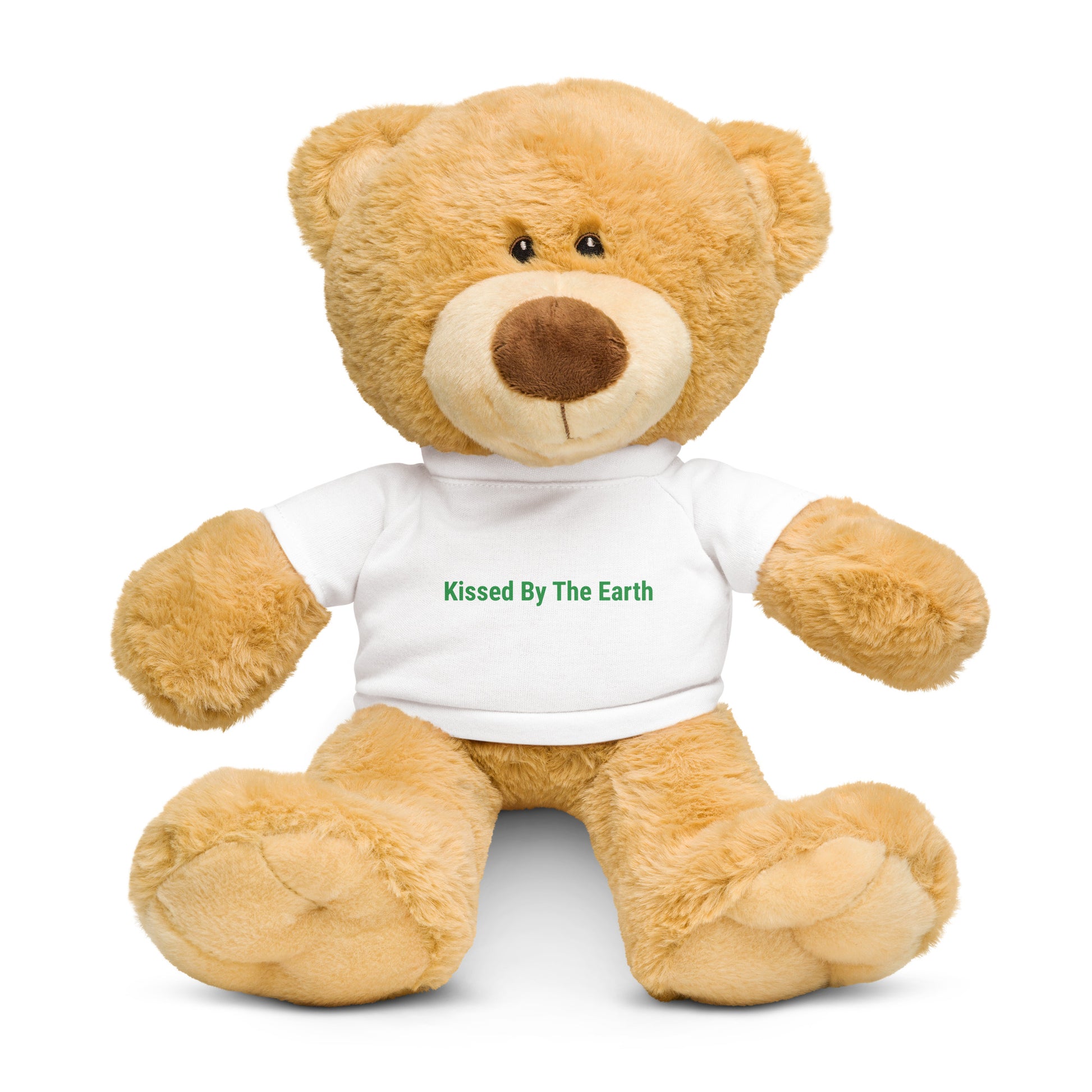 Teddy bear wearing a white shirt with 'Kissed By The Earth' text in green 